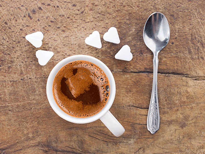 Cup of coffee with some hearts.