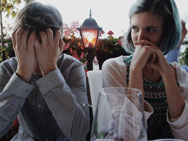 A man and a woman who are overthinking their relationship.