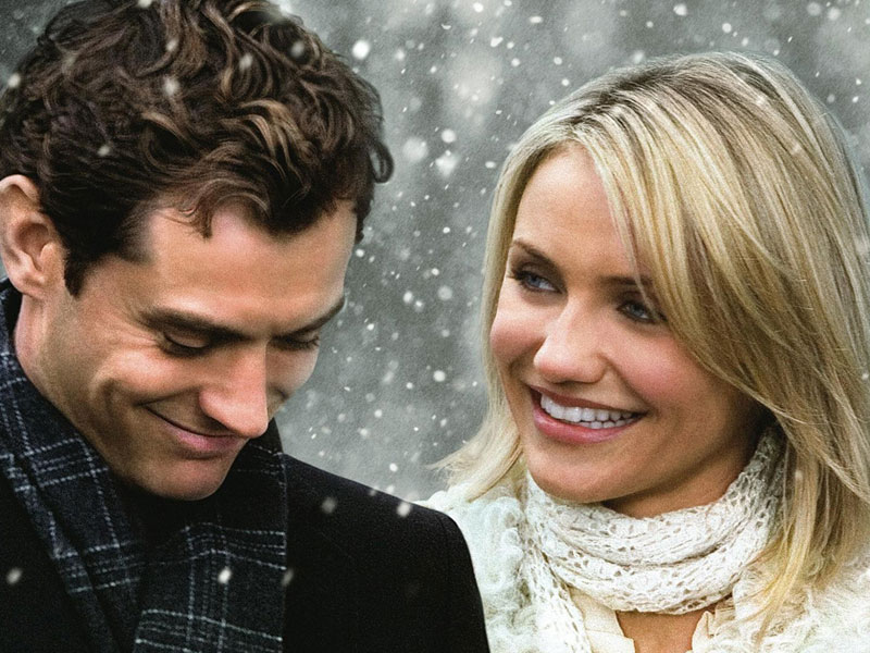 These dating tips came from rom-coms like The Holiday. Cameron Diaz and Jude Law smiling in the snow together.