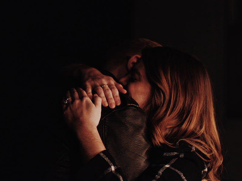 A woman who keeps seeking out dysfunctional relationships hugging the man she's with tightly.