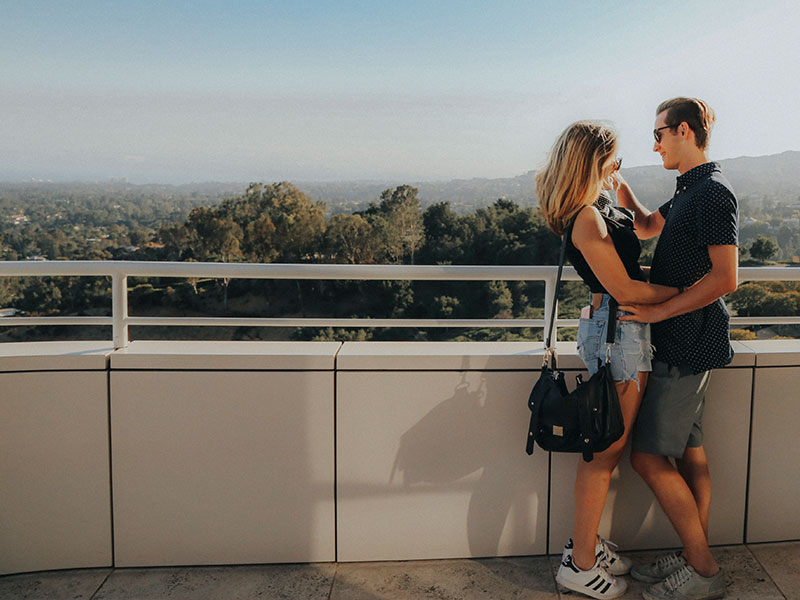 A man who learned how to get your ex back, touching his girlfriend's chin after they had a long talk about getting back together.