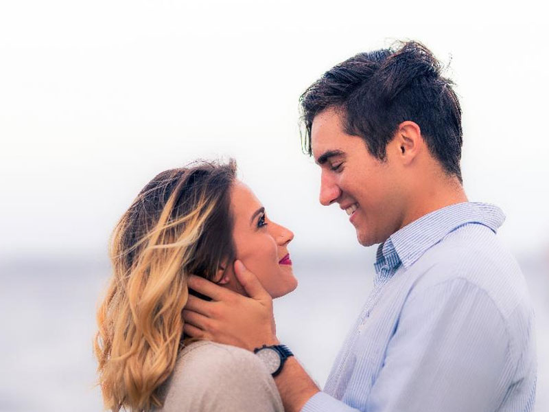 A man showing one of these signs a man is falling in love with you, looking into his girlfriend's eyes adoringly.