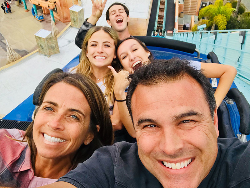 A man dating with kids after divorce, on a roller coaster with a date and his three teenaged kids.