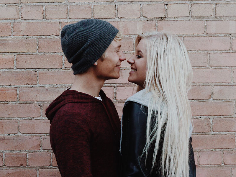 A guy who's looking for signs your ex will eventually come back looking into the eyes of her ex while they hug outside.