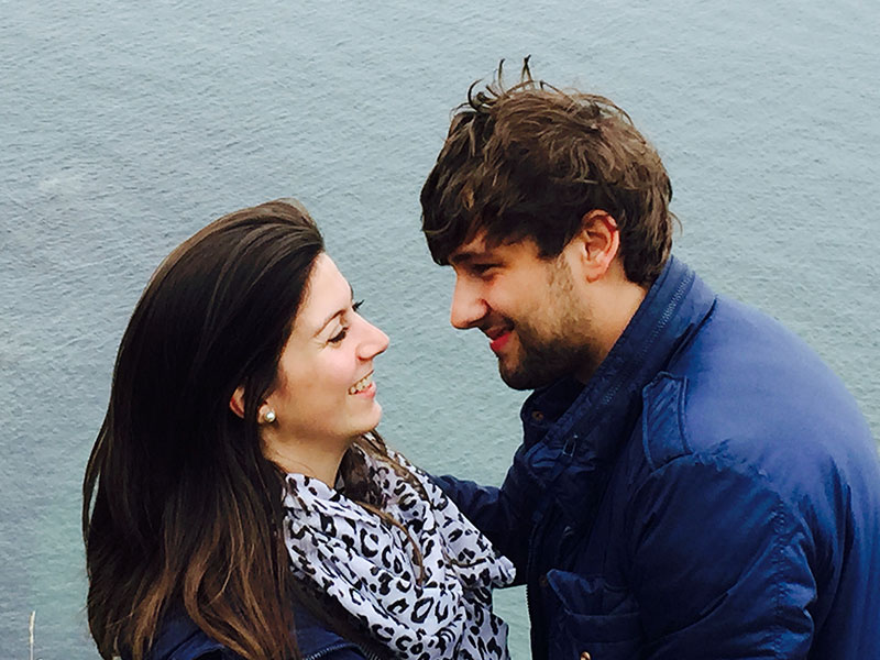 A man dating a divorcee, looking into the eyes of the woman he's on a date with while they're on a boat.