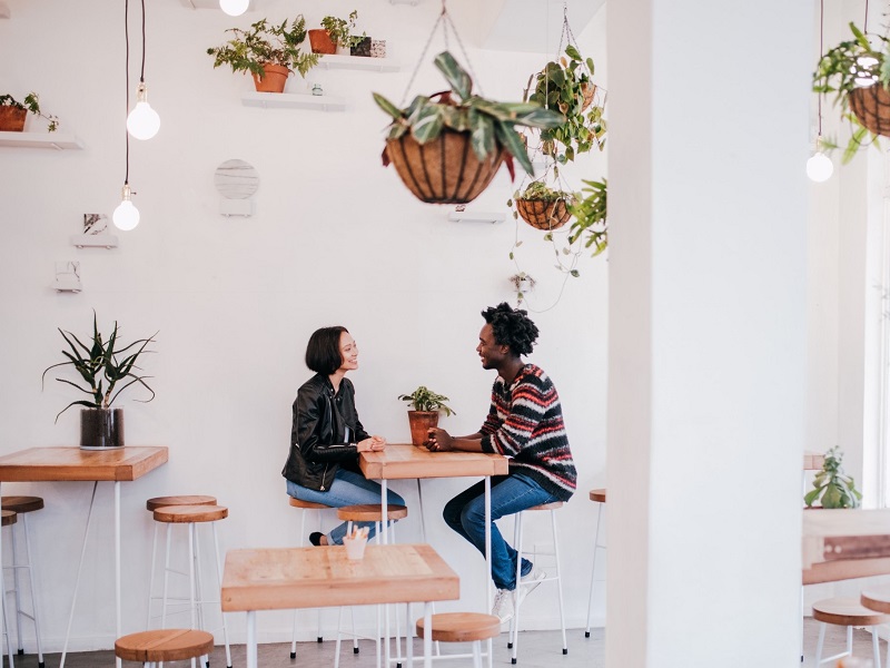 Attractive couple chatting about questions to ask on a first date