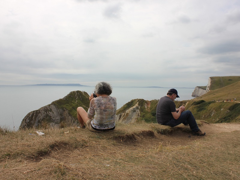 Frustrated couple overlooking the sea, considering should I get a divorce or not