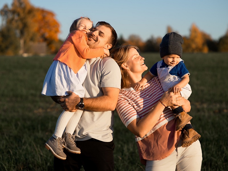 blended family meeting and laughing in the park