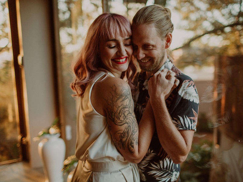 happy couple dancing as she learns to understand men better