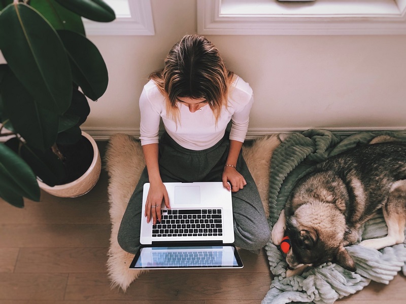 Girl typing on laptop at home in dating and coronavirus time