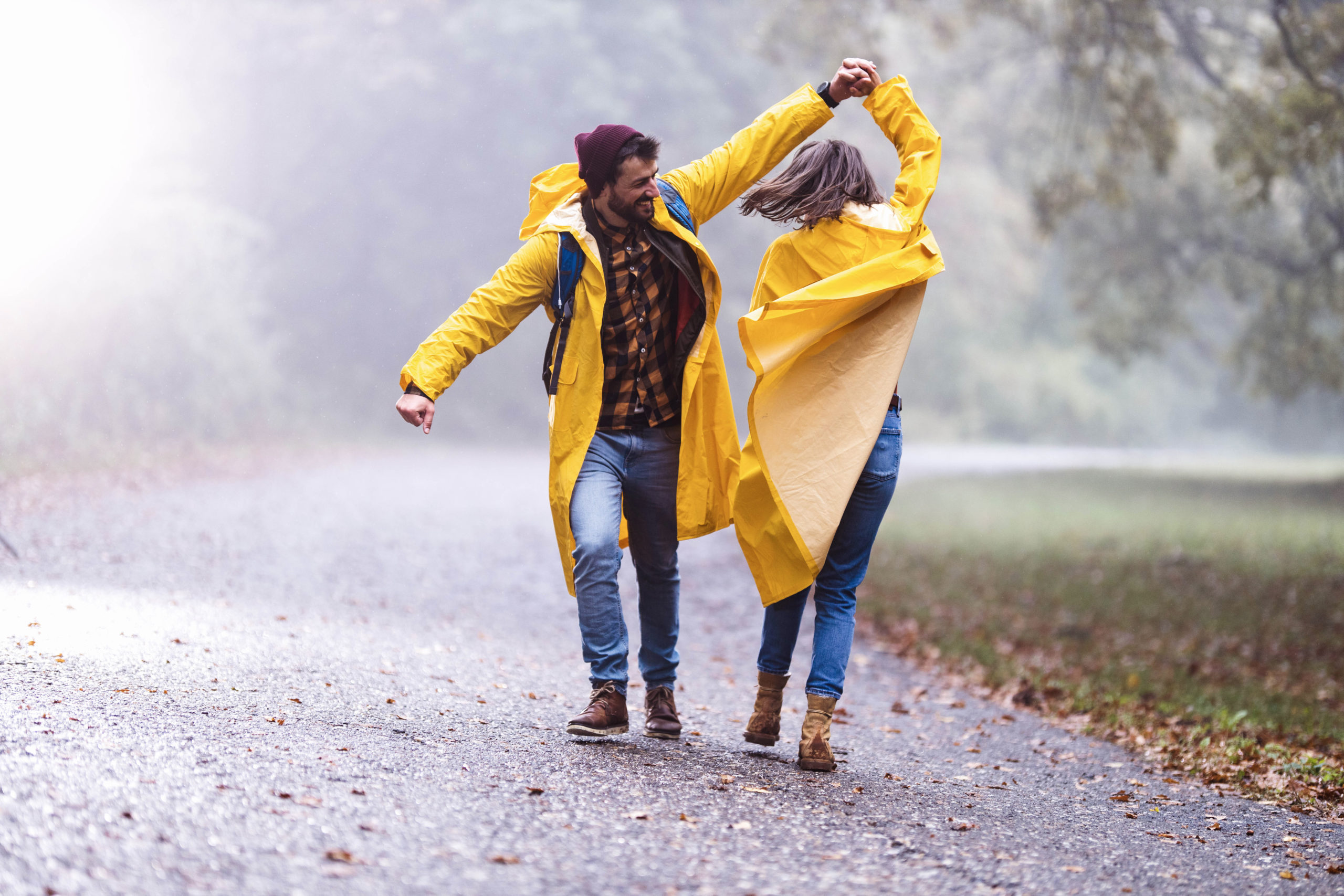couple dancing in the rain on a date