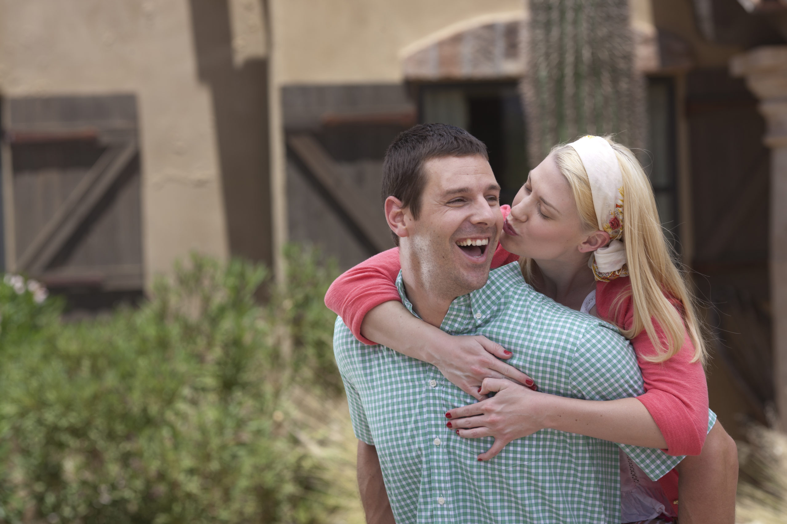 Happy, smiling couple embracing each other while dating in Tucson, Arizona.