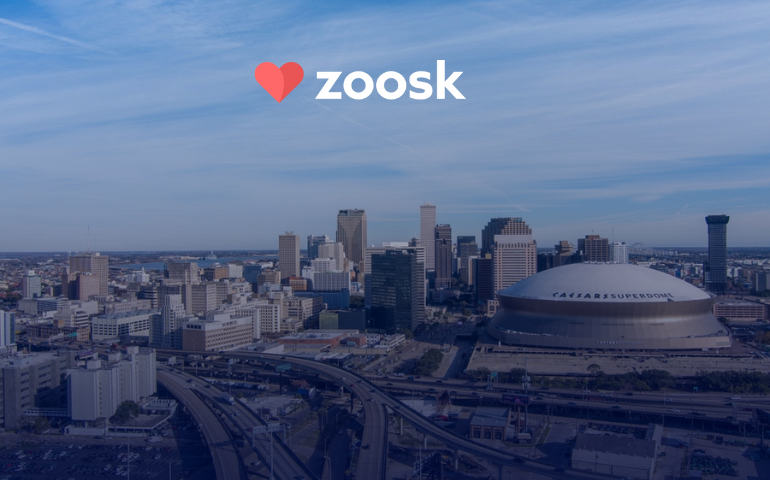 Aerial view of New Orleans skyline featuring the Superdome and Interstate 10